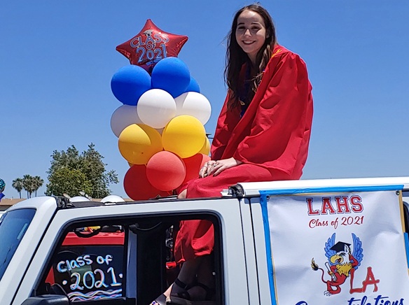 Los Alamitos graduates parade through the streets of Rossmoor